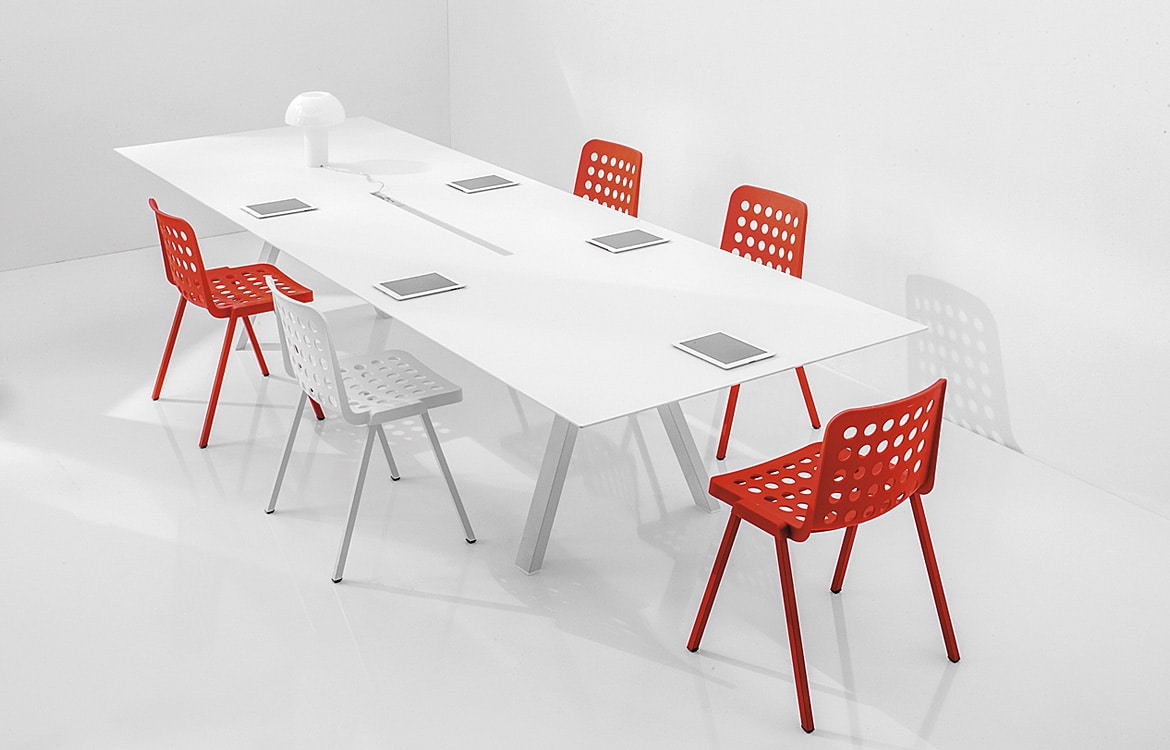 white conference table with red chairs